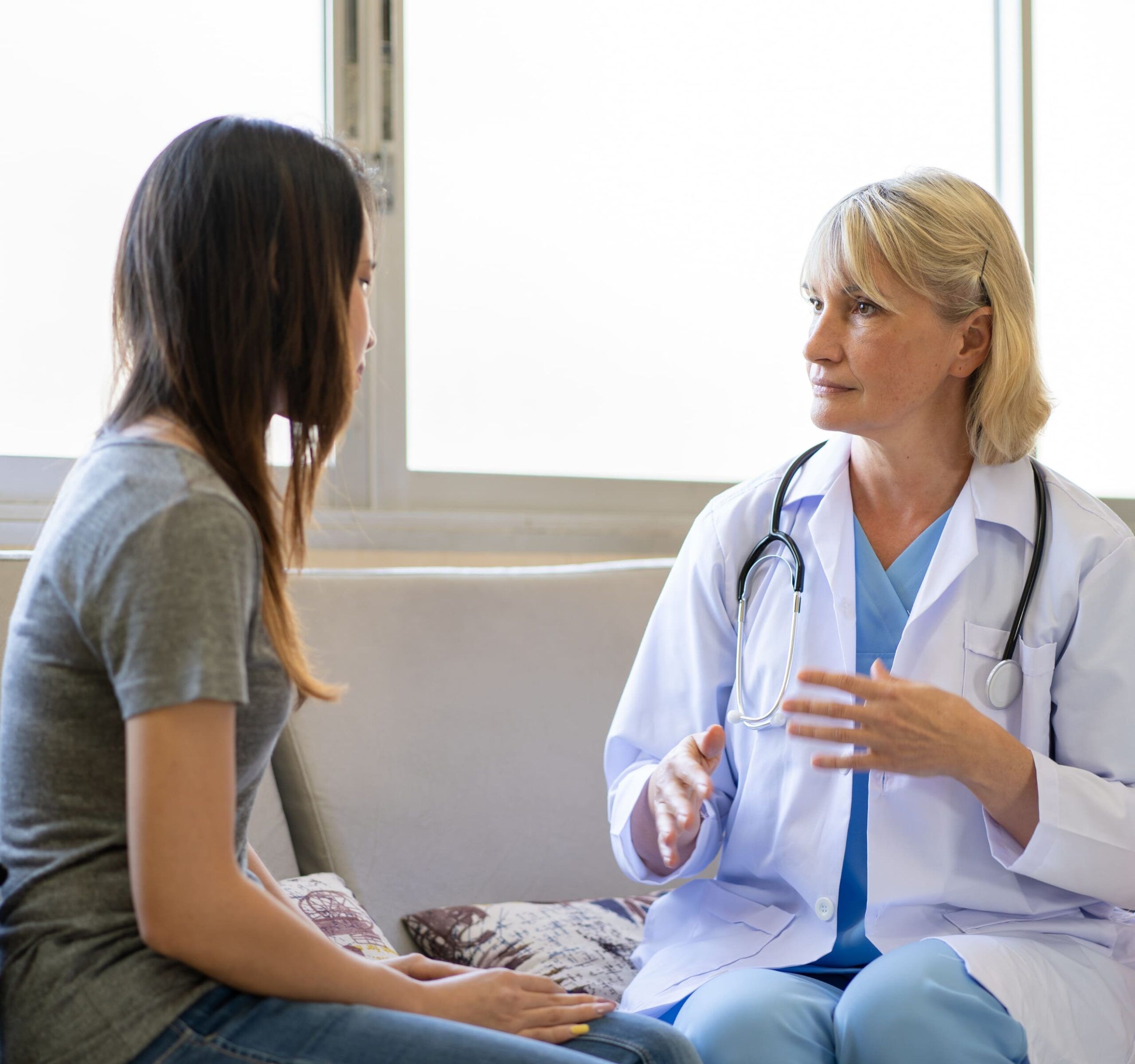 A therapist engages in conversation with a client during therapy in Hendersonville, TN.
