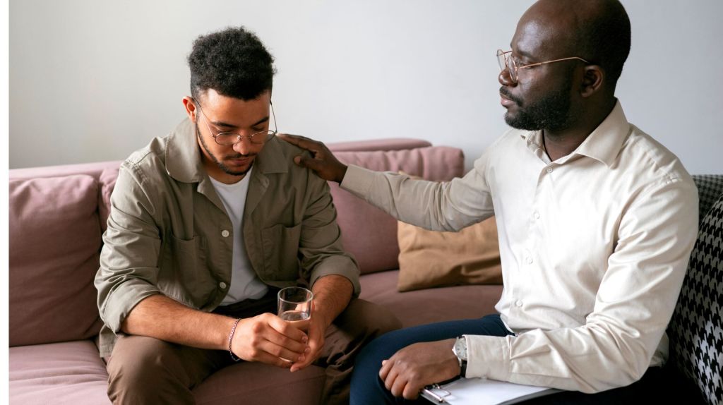 A therapist offering support to a client in a therapy in Hendersonville, TN.