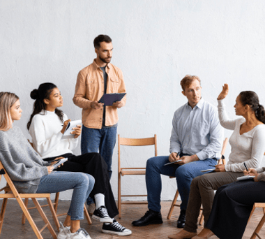 People participate in a psychiatry group session through health minds.