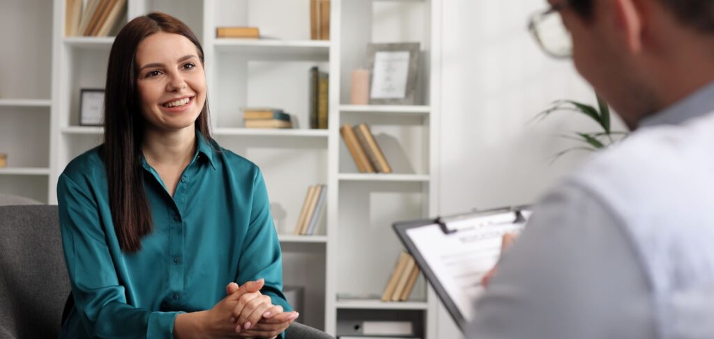 A woman smiling during her CPTSD treatment in Nashville.